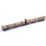 Pre-war Hornby-Dublo articulated two-coach set NE teak. Silvering going and a few marks. (F-G)