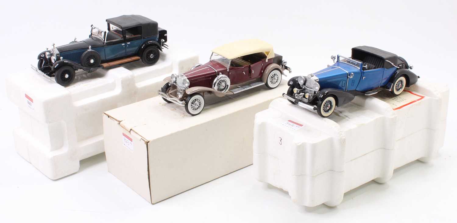 A collection of three Franklin Mint 1/24 scale diecast vehicles all housed in original cardboard