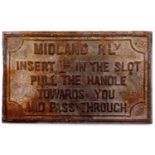 An original Midland Railway cast iron sign "Insert 1d in the slot, pull handle towards you, and pass