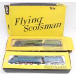 Three boxed Trix 00 gauge locomotives to include Mallard, Flying Scotsman and Blue Peter, all housed