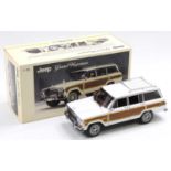 An Autoart Millennium 1/18 scale boxed diecast model of a Jeep Grand Wagoneer, 1989 example,