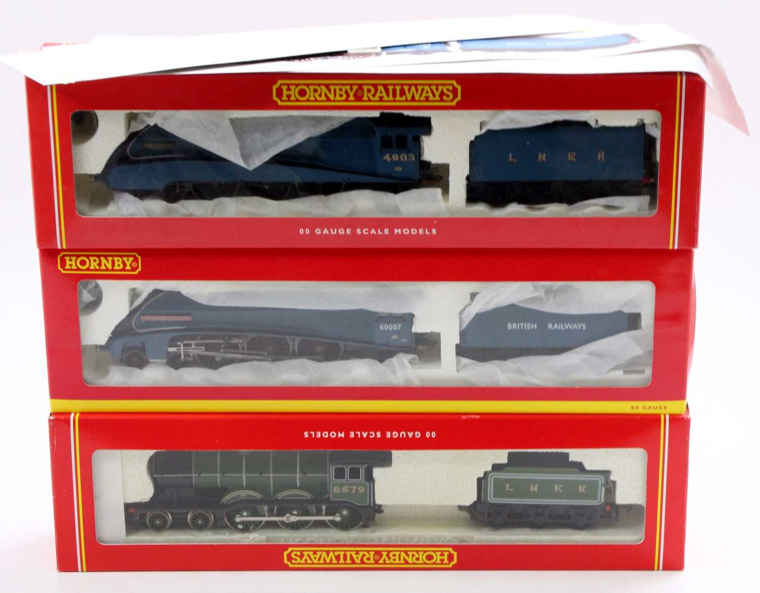 Three boxed Hornby 00 gauge locomotives to include a No. R284 B12 LNER Class locomotive and