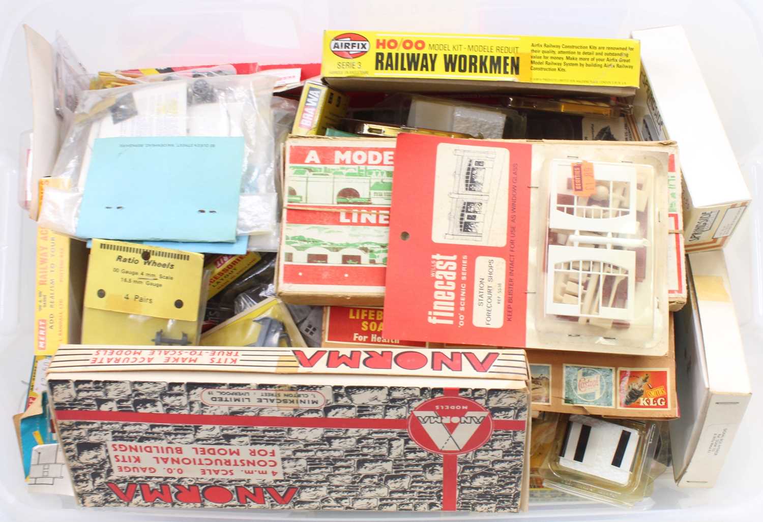 One box containing an extensive collection of various 00 gauge and HO scale plastic kits, lineside