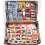 Two trays containing a collection of various Matchbox Hotwheels and Tesco release boxed and carded