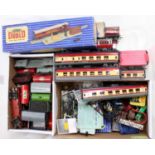 Large plastic crate containing Hornby-Dublo rolling stock and a variety of small accessories: 7 x