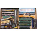 Two trays containing a collection of mixed 00 scale items of rolling stock and locomotives to