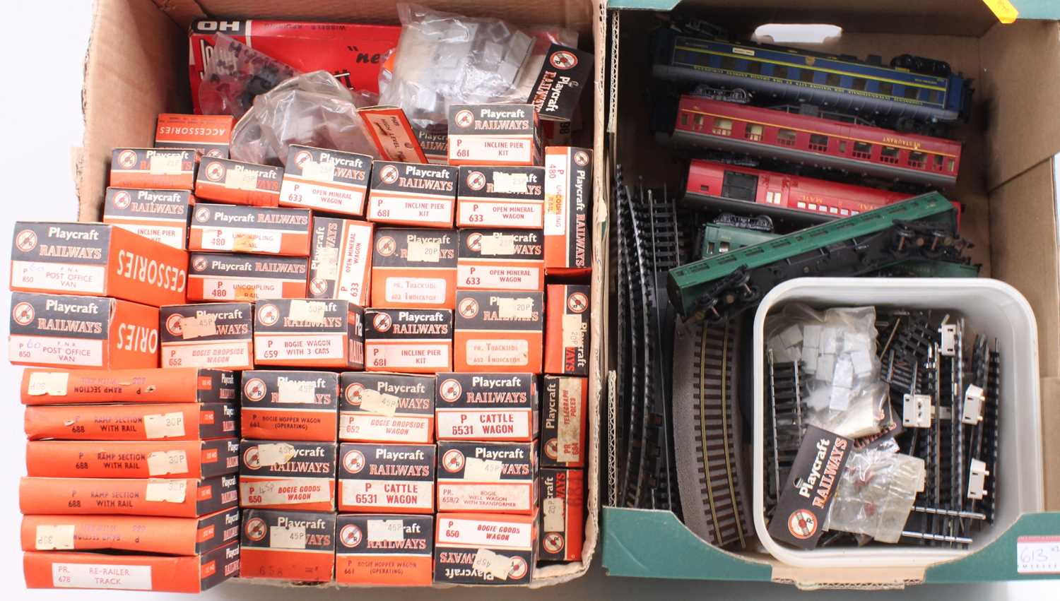 Two boxes containing a collection of mixed Playcraft, HO scale railways, to include various loose