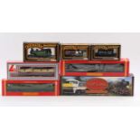 Seven boxed 00 gauge locomotives and rolling stock to include a Hornby Toplink Bideford West Country