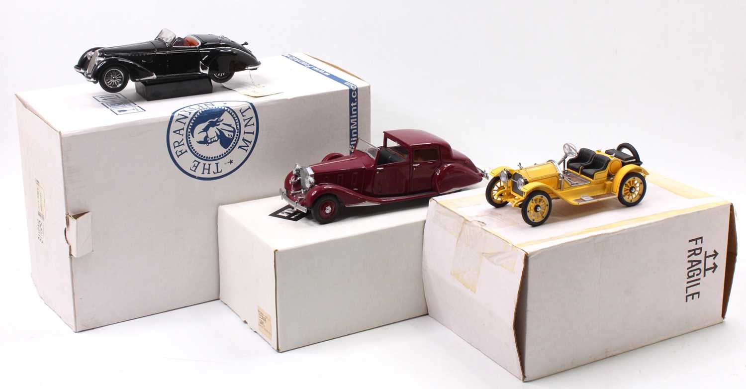 A Franklin Mint 1/24 scale boxed diecast group, three various examples to include a limited