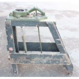 A cast iron Mclover of Leeds and Co pedal driven clamp, suitable for kindling wrapping, raised on