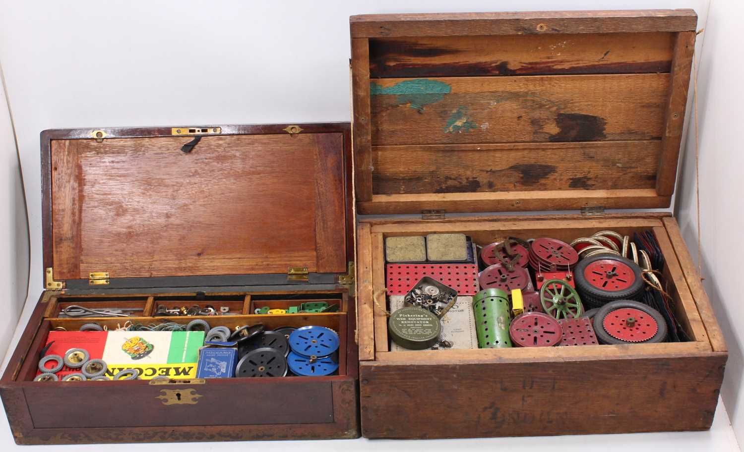 Two wooden boxes containing a large quantity of vintage Meccano including wheels, flat plates,