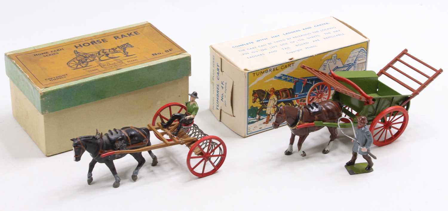 A Britains boxed agricultural farming horsedrawn vehicle group to include a No. 8F horse rake housed