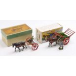 A Britains boxed agricultural farming horsedrawn vehicle group to include a No. 8F horse rake housed