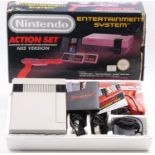 An Nintendo NES Action Set comprising of console, control pads, zapper light gun, double game pack