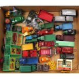 A tray containing a selection of play-worn Dinky Toys including a No. 36G Taxi, No. 25D Petrol