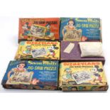 A collection of vintage Walt Disney Jigsaws including Snow White and the Seven Dwarfs, Donald