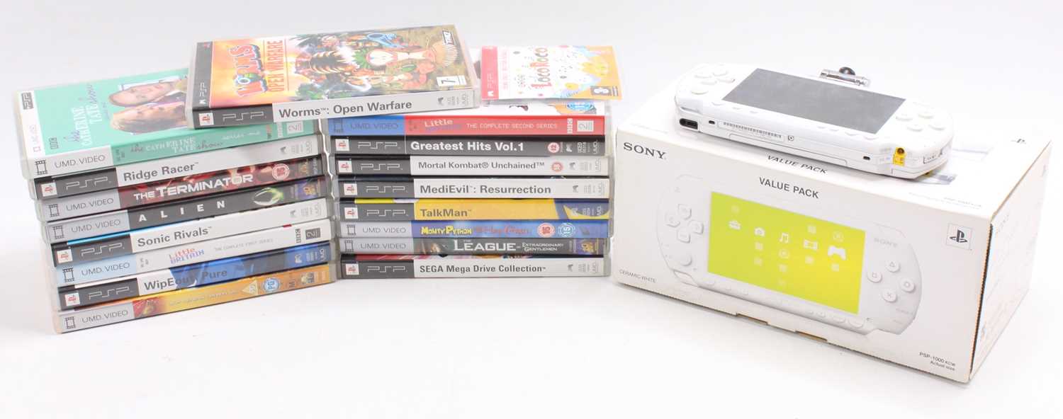 A Sony Play Station Portable PSP console and the original box together with a collection of