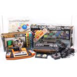 Three boxed vintage electronic games consoles to include the Atari model No. CX-2600 video