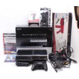 A collection of various Play Station related video game consoles, leads, and accessories to