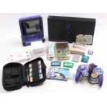 A collection of mixed video game consoles and games including a Playstation 2, Nintendo 3DS, a