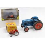 A collection of various boxed and loose tractors to include a Chad Valley diecast and clockwork