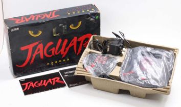 An Atari Jaguar 64-bit Interactive Multi Media console/gaming system housed in the original card box