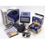 A Nintendo Japanese (NTSC) boxed game cube console, violet blue example, complete with boxed