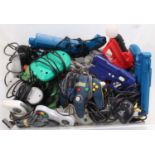 A large tray containing a collection of mixed video game and console related hand guns, controllers,