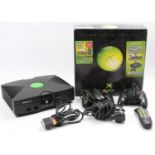 An original Xbox Series 1 console, together with various power leads, Xbox remote, original box, and