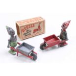 A boxed Woggle - The Walking Marvel, comprising of figure with wheelbarrow, together with one