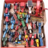 A collection of Britains, Corgi and Dinky model tractors, with specific examples including a