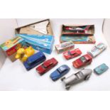 A collection of tinplate toys with examples including a boxed Daiya Boeing SST jet plane, a Bandai