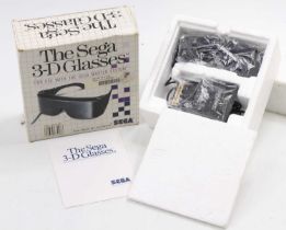 A Sega Master System 3-D glasses housed in the original polystyrene packed card box, rare example