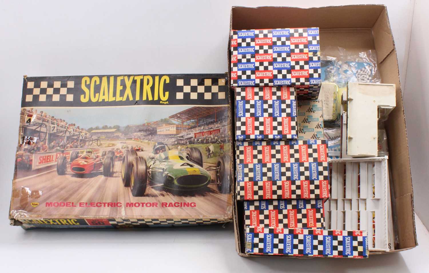 A group of Scalextric boxed raceway accessories, ephemera, Championship winning trophies, plastic