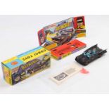 A Corgi Toys No. 267 Batmobile comprising of first issue gloss type black body with gold and red Bat