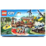 Lego City No. 60068 Crooks Hideout Set, containing a criminals hideout, boats, helicopter, and