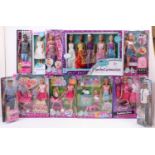 A collection of boxed children's dolls, with specific examples including a Steffi Baby Walk Doll,
