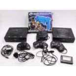 A collection of Sega Saturn loosed consoles, control pads, memory cards, power leads and