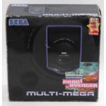 A Sega Multi-Mega console unit, housed in the original two-tier card Road Avenger box, comprising of