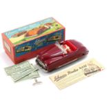 Schuco No. 4012 tinplate and clockwork radio car, maroon body, red interior, 2 clockwork motors to