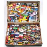Two trays containing a collection of mixed Matchbox Hotwheels and similar scale modern release and