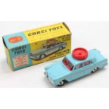 A Corgi Toys No. 236 Motor School Car comprising of light blue body with red interior, and spun hubs