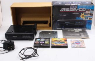 A Sega Mega-CD console unit for use with the original Sega Megadrive, comprising of console, power