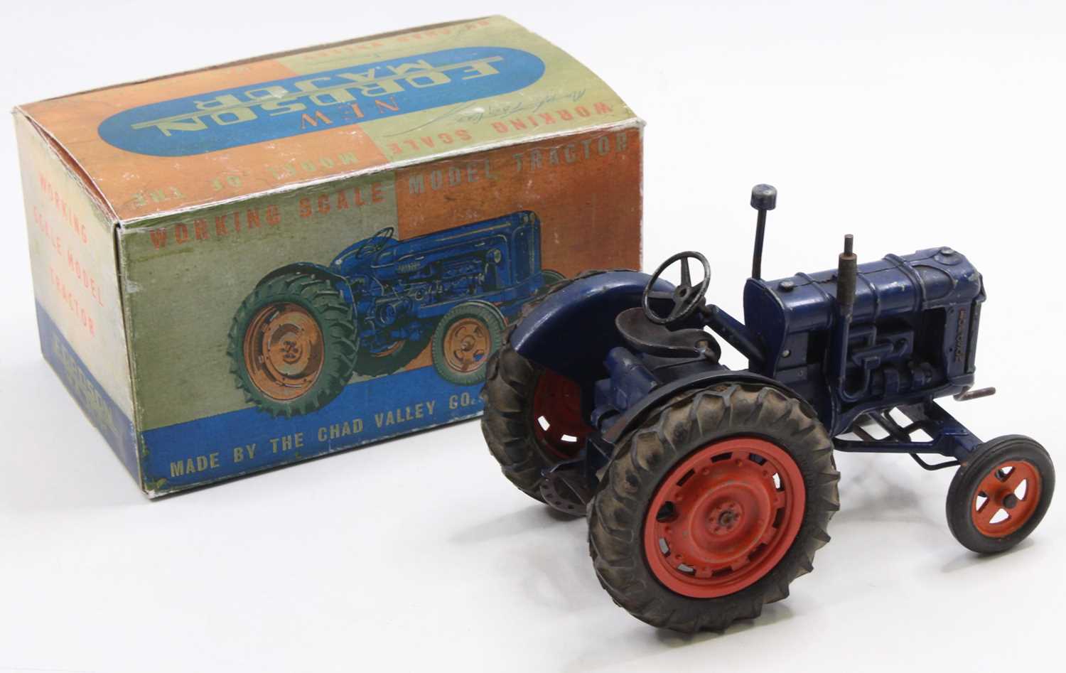 A Chad Valley diecast and clockwork Fordson Tractor, dark blue body with orange hubs, working - Image 2 of 2