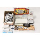 A collection of mixed Nintendo Wii games consoles, controllers, accessories, Wii Fit playboards, and