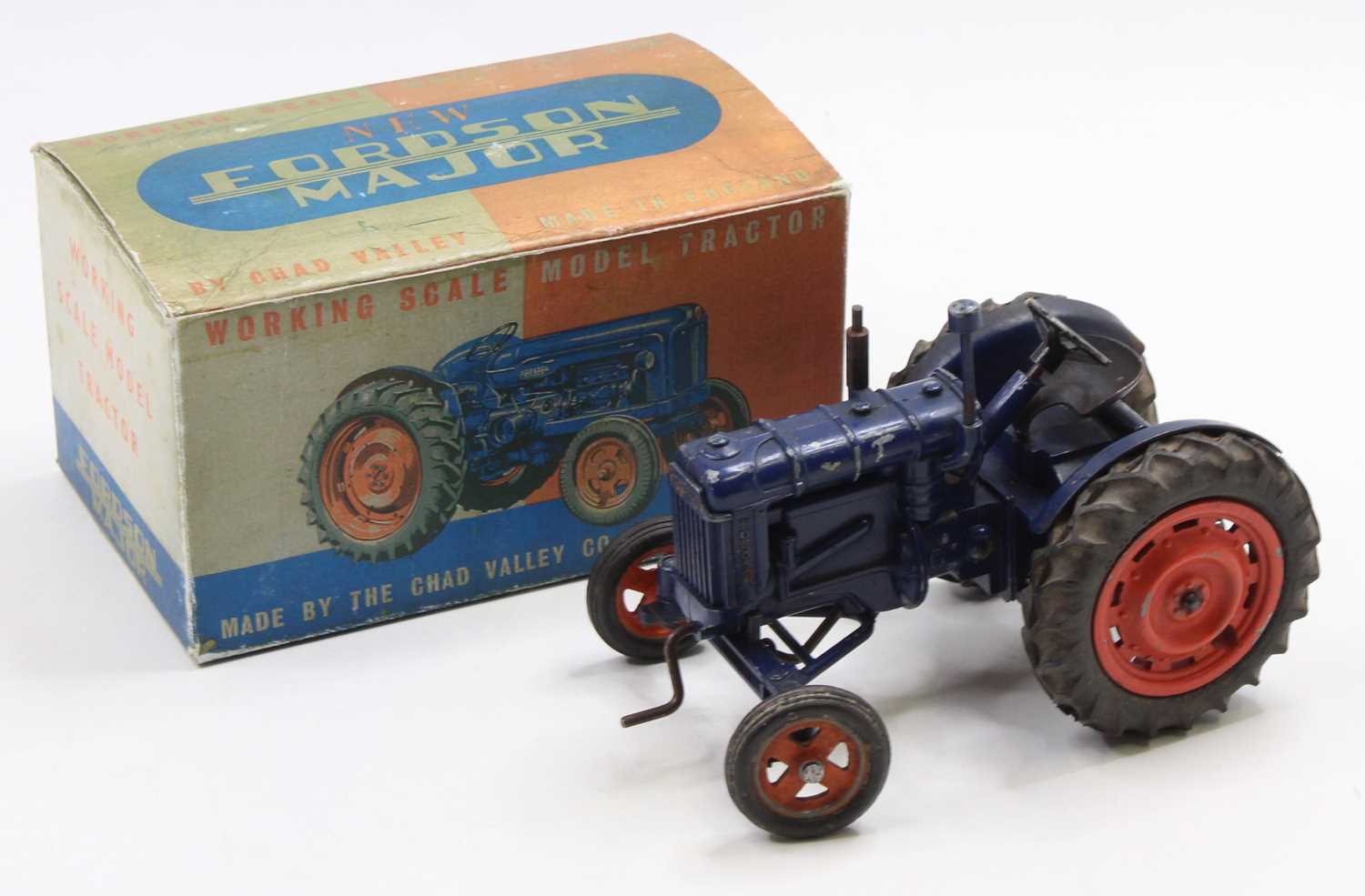 A Chad Valley diecast and clockwork Fordson Tractor, dark blue body with orange hubs, working