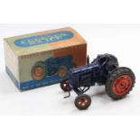 A Chad Valley diecast and clockwork Fordson Tractor, dark blue body with orange hubs, working