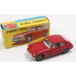 Corgi Toys No. 327 M.G.B GT in red with wire wheels and comes complete with black suit case, sold in