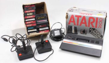 An Atari 2600 video computer system housed in the original box together with the box containing a