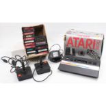 An Atari 2600 video computer system housed in the original box together with the box containing a